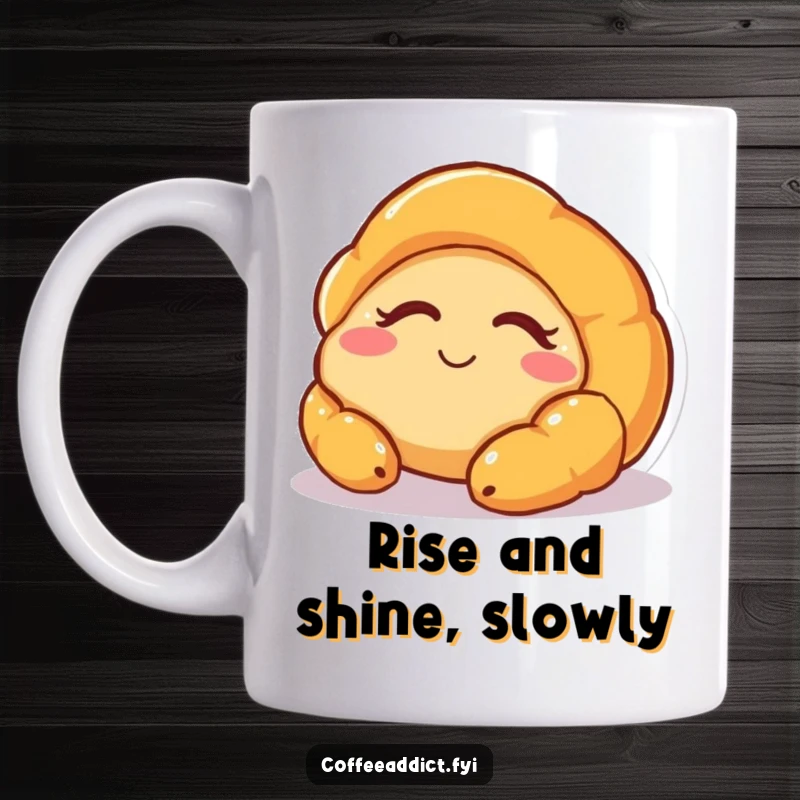 Funny mug featuring a cute, sleepy croissant character slowly waking up with a gentle, happy smile, embodying morning peace.