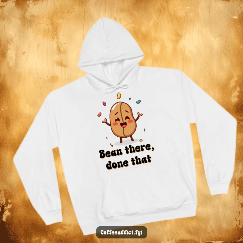 Funny hoodie with a cheerful coffee bean giggling and juggling three colorful sprinkles with a playful expression.