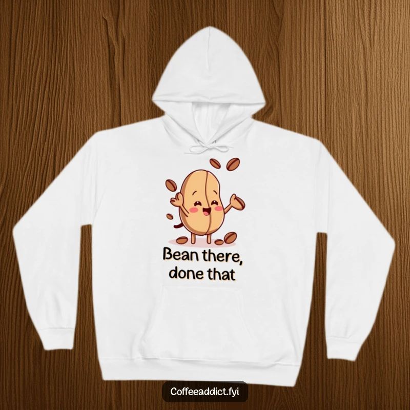 Funny hoodie featuring a smiling coffee bean juggling smaller beans, perfect for cozying up with a laugh and a warm drink.