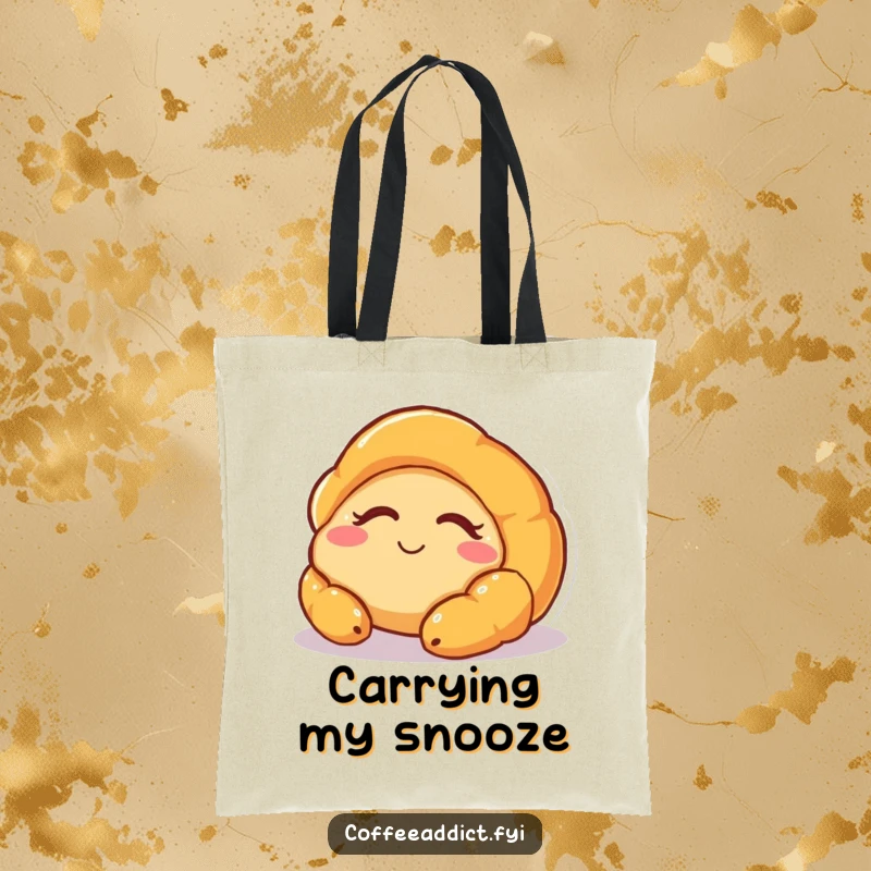 Funny tote bag showcasing a sleepy croissant character with a peaceful smile, great for carrying daily items with a touch of whimsy.